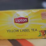 A yellow box of Lipton Yellow Label tea bags with the red Lipton shield logo.