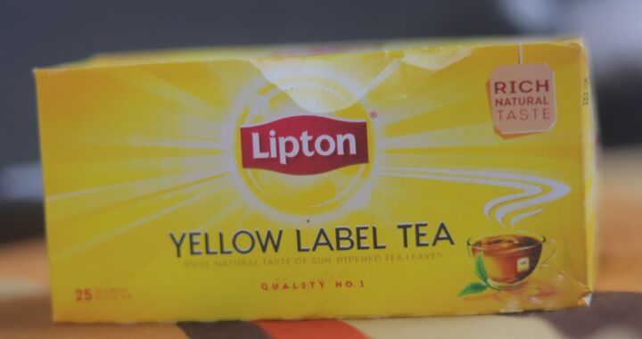 A yellow box of Lipton Yellow Label tea bags with the red Lipton shield logo.