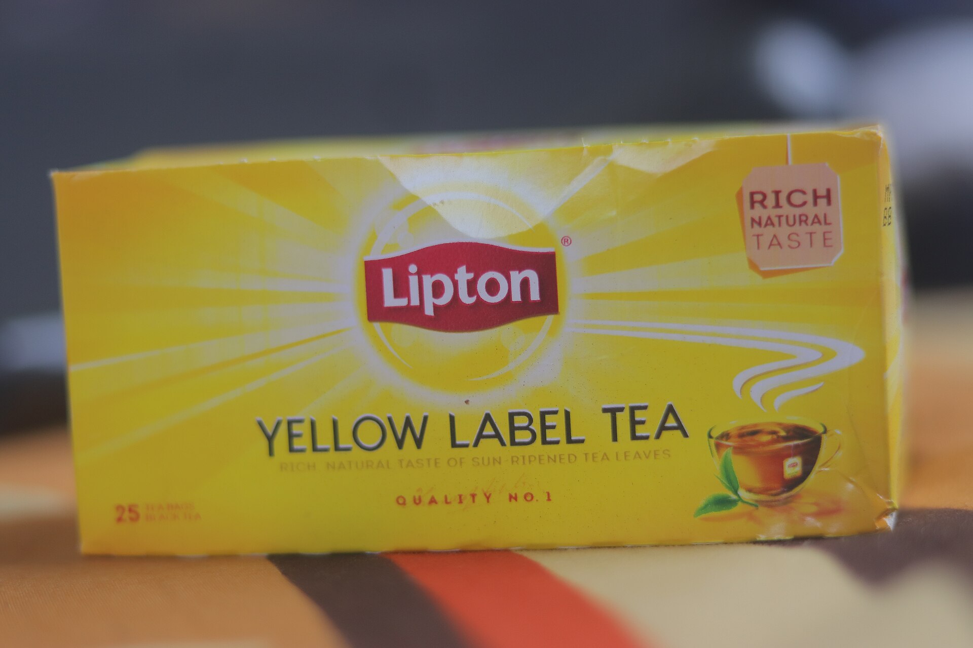 A yellow box of Lipton Yellow Label tea bags with the red Lipton shield logo.